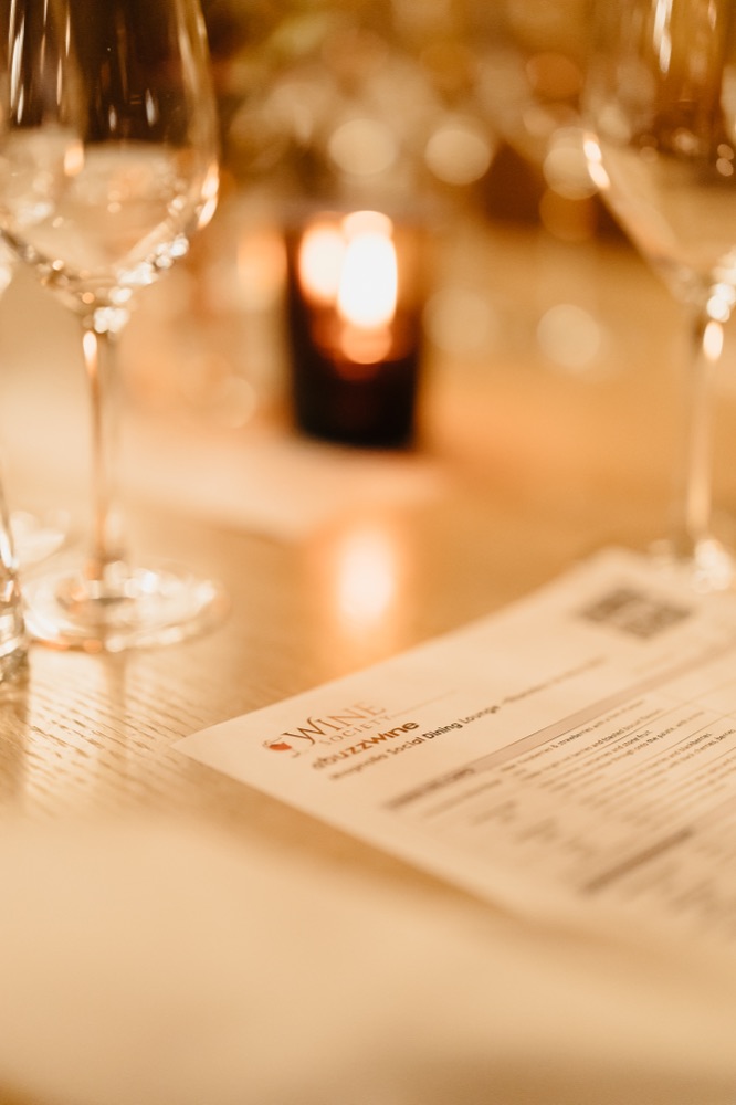 A Wine Society evening menu card on the table