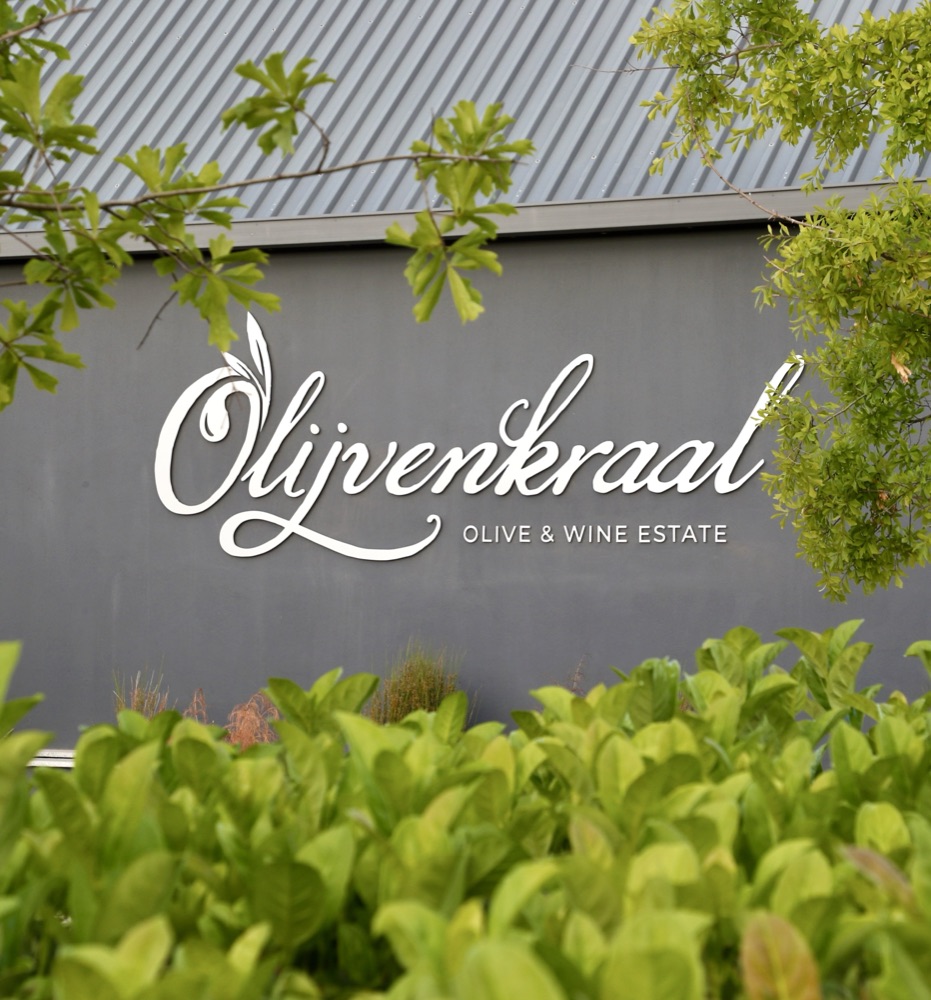 Olijvenkraal Olive & Wine Estate signage on the FYRE building